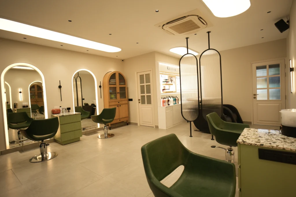 Bellance Salon women's floor showing styling stations, arched mirrors, Kérastase display, and decorative oval partitions